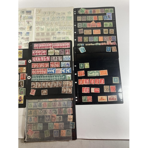 353 - A GROUP OF GERMAN STAMPS ON SHEETS