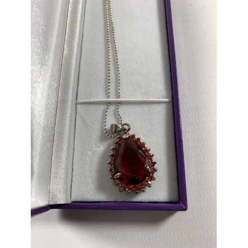 685 - A BOXED SILVER NECKLACE WITH RED STONE