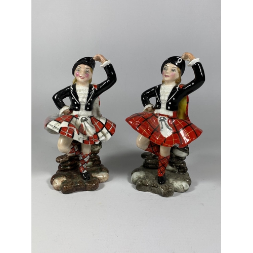 767 - TWO POTTERY FIGURES OF SCOTTISH DANCERS