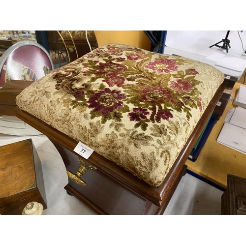 77 - A MAHOGANY OTTOMAN ON BUN FEET WITH BRASS HANDLES AND FLORAL EMBROIDERED SEAT