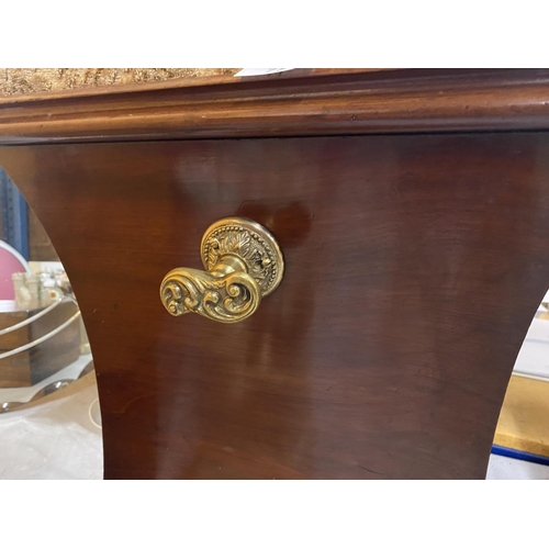 77 - A MAHOGANY OTTOMAN ON BUN FEET WITH BRASS HANDLES AND FLORAL EMBROIDERED SEAT