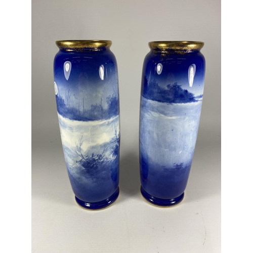 821 - A PAIR OF VINTAGE ROYAL DOULTON BLUE CHILDREN VASES, HEIGHT 29CM