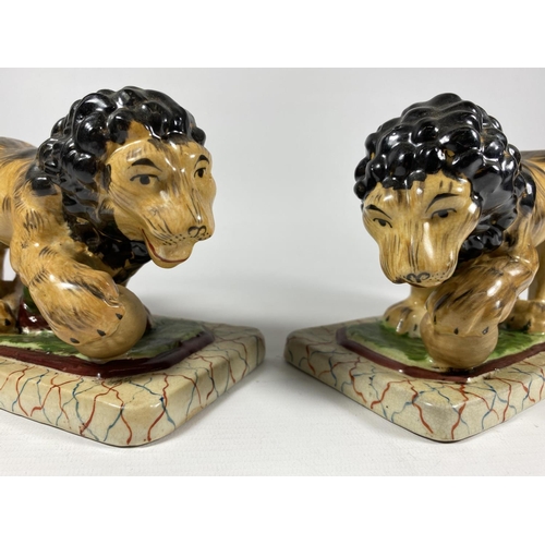 87 - A PAIR OF STAFFORDSHIRE POTTERY LION MODELS, LENGTH 19CM