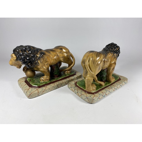 87 - A PAIR OF STAFFORDSHIRE POTTERY LION MODELS, LENGTH 19CM