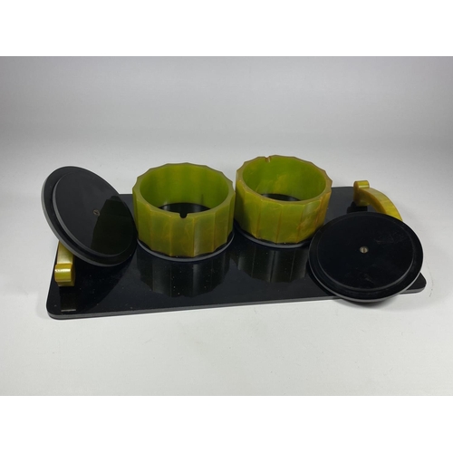 9 - A 1950'S ART DECO STYLE BLACK & GREEN BAKELITE DRESSING TRAY WITH LIDDED POTS, 34 X 18CM