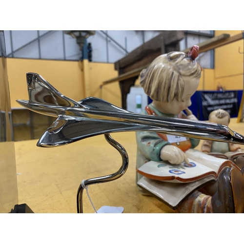 90 - A CHROME MODEL OF CONCORDE ON A WOODEN BASE HEIGHT 19CM