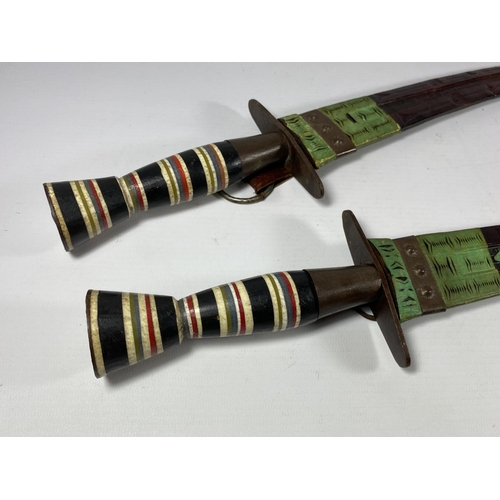 95 - A PAIR OF EGYPTIAN / MIDDLE EASTERN CEREMONIAL DAGGERS