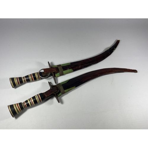 95 - A PAIR OF EGYPTIAN / MIDDLE EASTERN CEREMONIAL DAGGERS