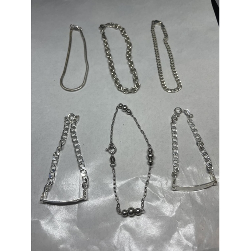 688 - A GROUP OF SIX ASSORTED SILVER BRACELETS