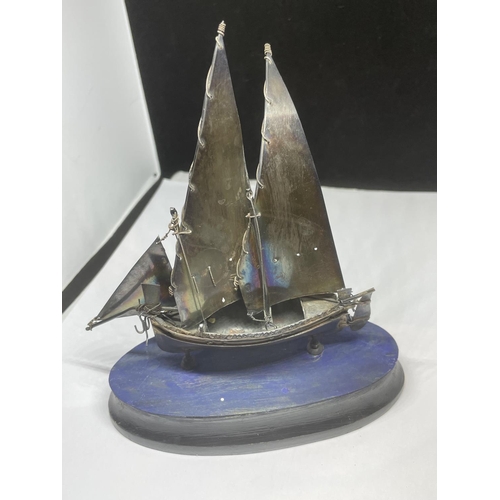 704 - AN UNUSUAL HALLMARKED SILVER MODEL OF A SHIP ON WOODEN BASE, HEIGHT 15CM