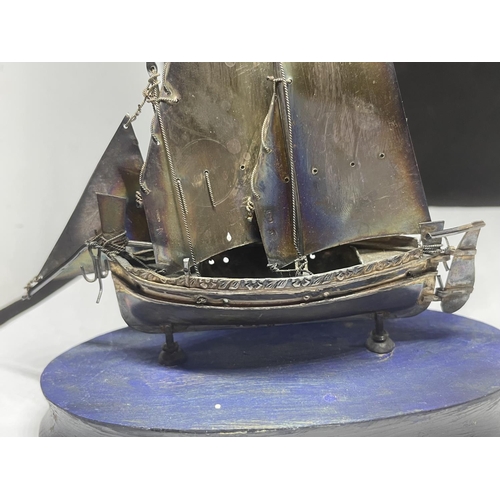 704 - AN UNUSUAL HALLMARKED SILVER MODEL OF A SHIP ON WOODEN BASE, HEIGHT 15CM