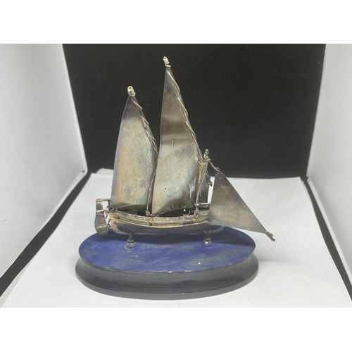 704 - AN UNUSUAL HALLMARKED SILVER MODEL OF A SHIP ON WOODEN BASE, HEIGHT 15CM