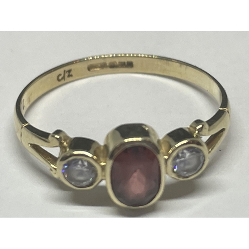 723 - A 9CT YELLOW GOLD GARNET AND CZ RING SIZE O/P