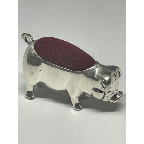 725 - A MINIATURE SILVER PIG PIN CUSHION