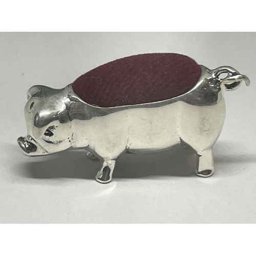 725 - A MINIATURE SILVER PIG PIN CUSHION