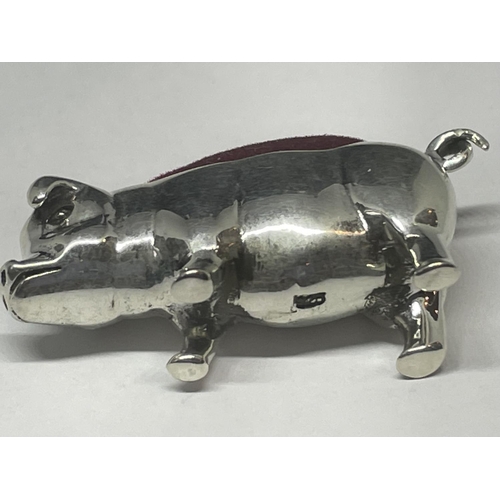 725 - A MINIATURE SILVER PIG PIN CUSHION