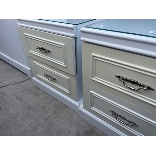 2609 - A PAIR OF MODERN CREAM AND WHITE BEDSIDE CHESTS