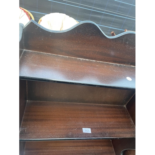 2620 - A MODERN MAHOGANY WATERFALL OPEN BOOKCASE WITH DRAWER TO THE BASE, 23