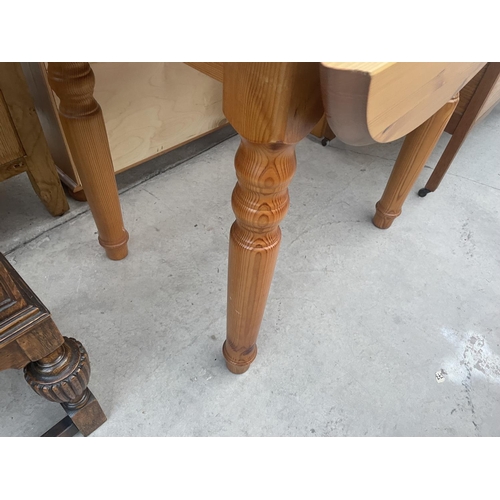 2629 - A MODERN PINE DROP-LEAF TABLE ON TURNED LEGS, 43