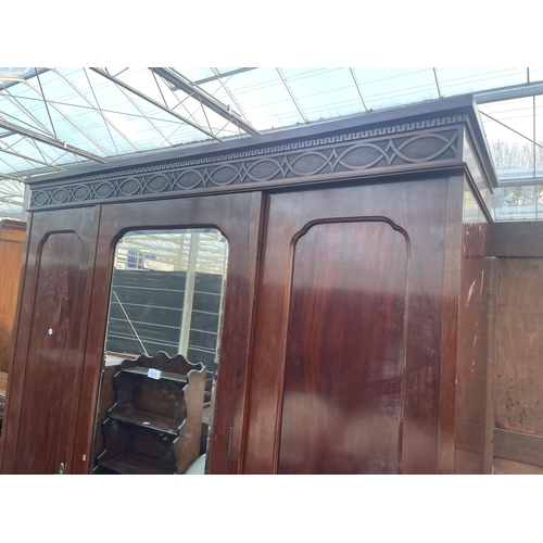 2633 - AN EARLY 20TH CENTUY MAHOGANY MIRROR-DOOR WARDROBE INTHE CHIPPENDALE STYLE, ON CABRIOLE LEGS WITH BA... 