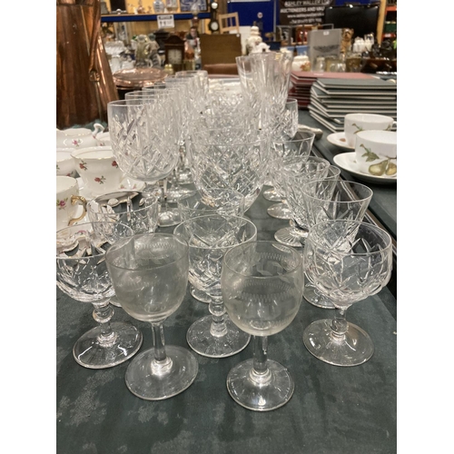 297 - A QUANTITY OF CUT GLASS TO INCLUDE WINE GLASSES, CHAMPAGNE FLUTES, ETC