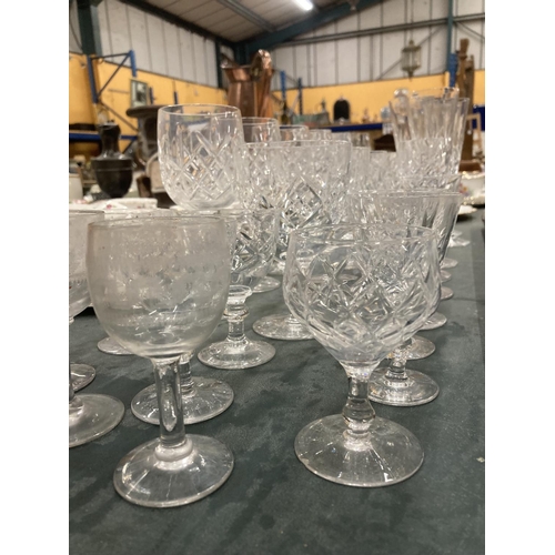 297 - A QUANTITY OF CUT GLASS TO INCLUDE WINE GLASSES, CHAMPAGNE FLUTES, ETC