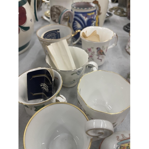 300 - A LARGE COLLECTION OF COLLECTABLE CUPS