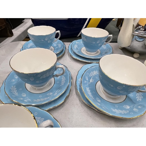 903 - FIVE COLCLOUGH BLUE AND WHITE TRIOS PLUS A CUP AND SAUCER