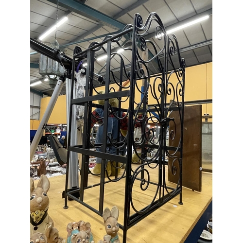 930 - A HEAVY TWELVE BOTTLE METAL WINE RACK WITH DOORS