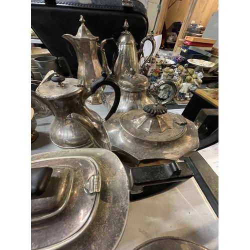 932 - A LARGE QUANTITY OF SILVER PLATED TEAPOTS AND COFFEE POTS