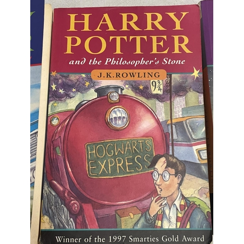 945 - THREE PAPERBACK HARRY POTTER BOOKS - THE CHAMBER OF SECRETS, THE PHILOSOPHERS STONE AND THE PRISONER... 