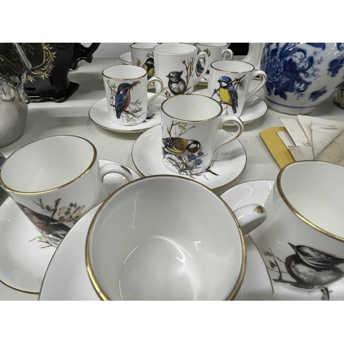 984 - A LARGE QUANTITY OF HAMMERSLEY & CO BONE CHINA COFFEE CANS AND SAUCERSWITH BIRD DESIGN TO THE CUP AN... 