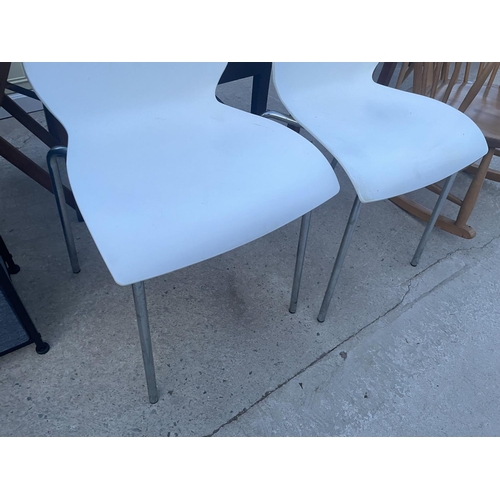 2665 - A PAIR OF KARTEL STYLE PLASTIC DINING CHAIRS ON CHROME BASES