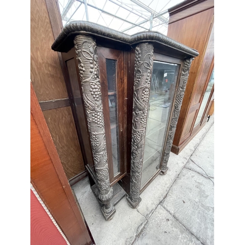 2675 - A HEAVILY CARVED VICTORIAN EBONISED BREAKFRONT DISPLAY CABINET WITH FOUR COLUMNS DEPICTING GRAPES AN... 