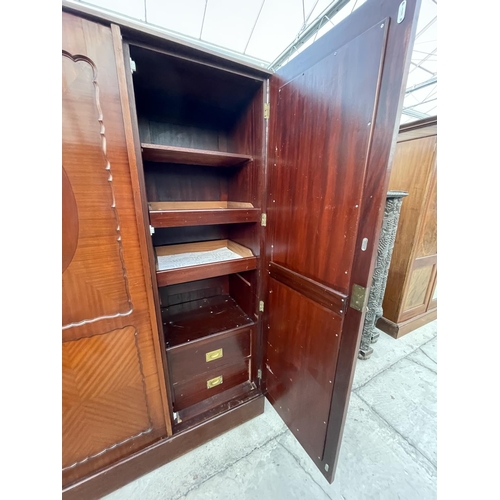 2676 - AN EDWARDIAN MAHOGANY TRIPLE WARDROBE WITH TWO DOORS HAVING MATERIAL LINING AND PIPING -