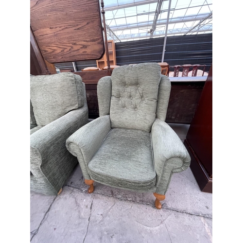 2677 - AN SHL WING BACK ARMCHAIR ON CABRIOLE SUPPORTS AND A TWO SEATER SOFA