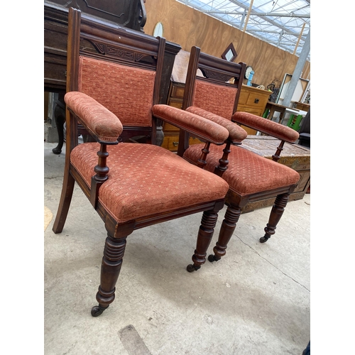 2481 - A PAIR OF VICTORIAN UPHOLSTERED ELBOW CHAIRS ON TURNED LEGS AND UPRIGHTS