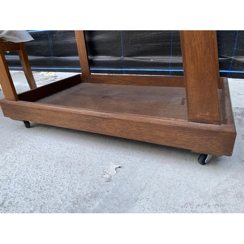 2560 - A RETRO OAK TWO TIER TROLLEY WITH INSET TILED TOP