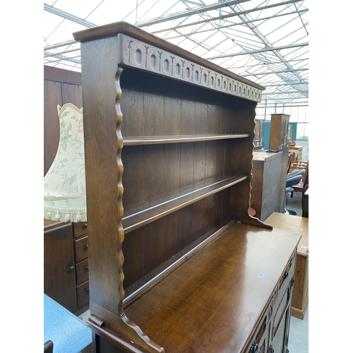 2583 - A REPRODUCTION OAK DRESSER BEARING LABEL 'ALLAN'S, HANLEY & STOKE' COMPLETE WITH PLATE RACK, 50