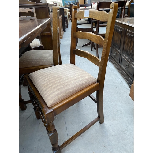 2584 - A REPRODUCTION OAK DRAW-LEAF DINING TABLE AND SIX LADDERBACK DINING CHAIRS