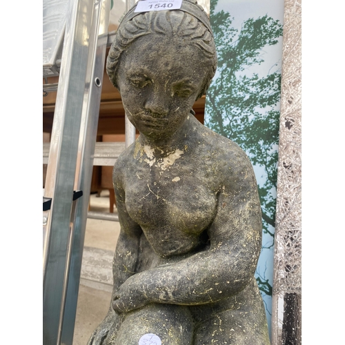 1540 - A RECONSTITUTED STONE FEMALE GARDEN FIGURE