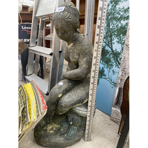 1540 - A RECONSTITUTED STONE FEMALE GARDEN FIGURE