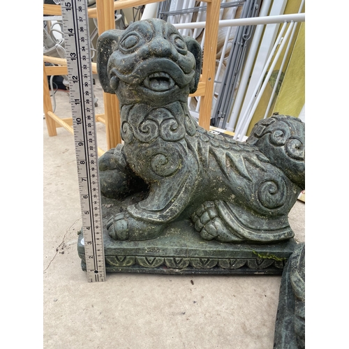 1595 - A PAIR OF RECONSTITUTED STONE ORIENTAL STYLE LIONS