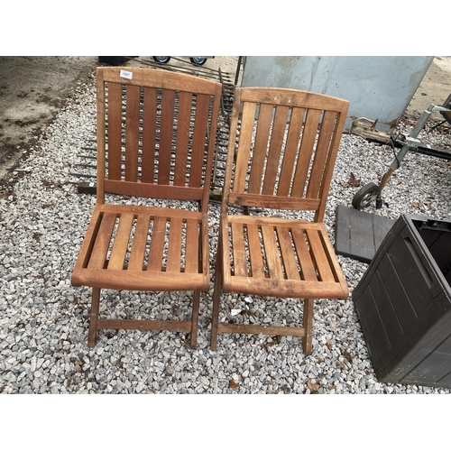 1647 - A PAIR OF TEAK FOLDING GARDEN CHAIRS