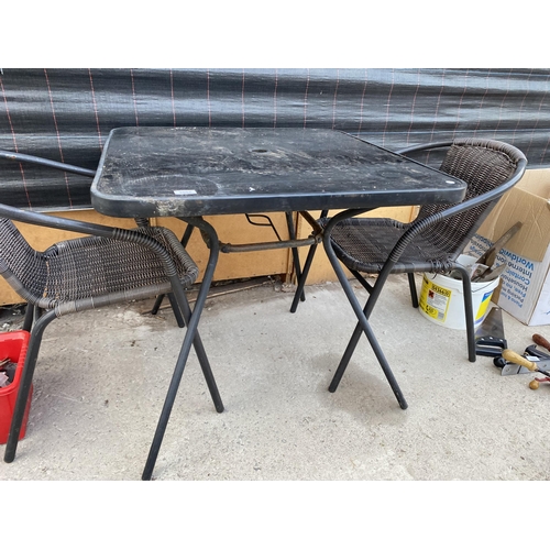 1662 - A SQUARE GLASS TOPPED BISTRO TABLE WITH TWO RATTAN STYLE CHAIRS