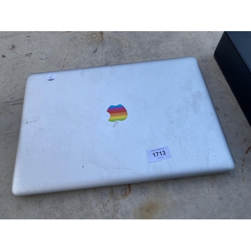 1713 - AN APPLE LAPTOP