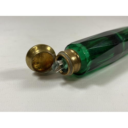 97 - A VINTAGE GREEN GLASS AND BRASS TOPPED DOUBLE SIDED PERFUME BOTTLE