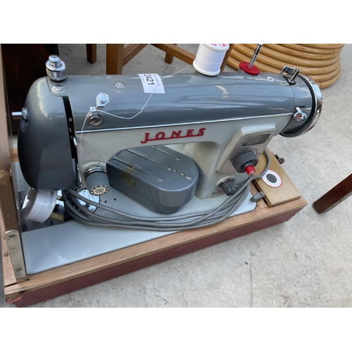 2421 - A JONES ELECTRIC SEWING MACHINE (MODEL CBE FOREIGN)