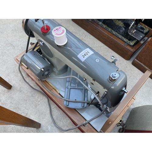 2421 - A JONES ELECTRIC SEWING MACHINE (MODEL CBE FOREIGN)