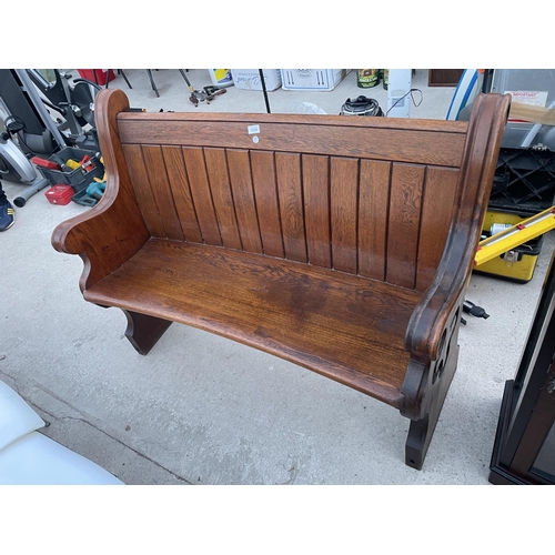 2700 - A VICTORIAN OAK PEW WITH CURVED BACK AND DISHED SEAT, 49.5